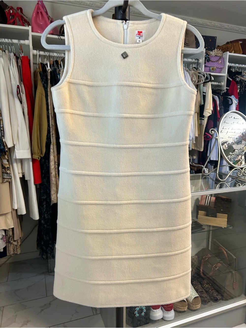 Courrèges dress features a structured silhouette with horizontal ribbed panels